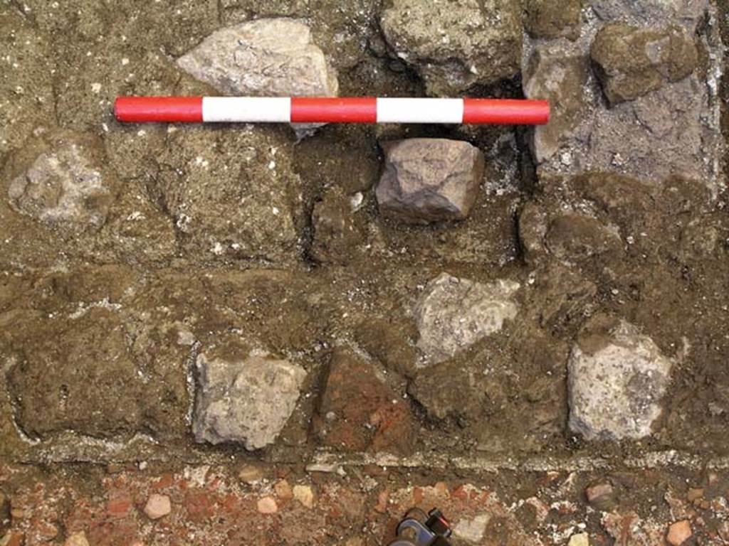 VI.25, Herculaneum. May 2004. Rear room, detail from flooring at north end on west side. Photo courtesy of Nicolas Monteix.